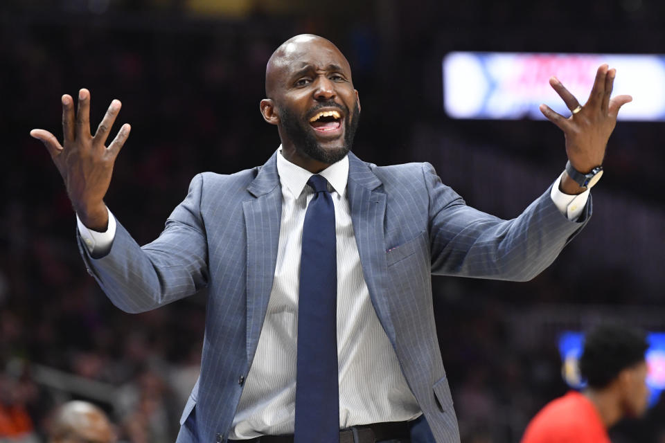 Atlanta Hawks coach Lloyd Pierce wants a foul called as he reacts toward an official during the second half of an NBA basketball game against the Milwaukee Bucks, Friday, Dec. 27, 2019, in Atlanta. (AP Photo/John Amis)