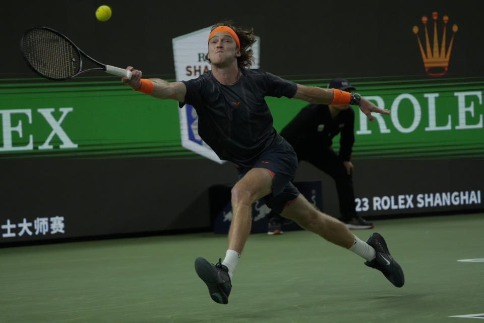 Andrey Rublev of Russia returns a shot to Tommy Paul of the United States during the 4th round of the men's singles match in the Shanghai Masters tennis tournament at Qizhong Forest Sports City Tennis Center in Shanghai, China, Wednesday, Oct. 11, 2023. (AP Photo/Andy Wong)