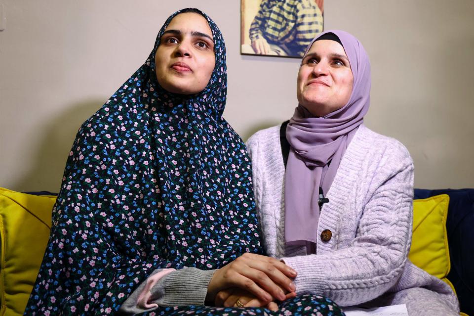 Marah Bakr (L) a Palestinian detained in Israeli prison for eight years and released on November 24, 2023, under a truce deal between Israel and Hamas in exchange for hostages held in Gaza, looks on as her mother Sawsan sits by her side in their home in east Jerusalem. After 48 days of gunfire and bombardment that claimed thousands of lives, the first hostages to be released under a truce deal between Israel and Hamas were handed over on November 24, both sides said, nearly seven weeks after they were seized.