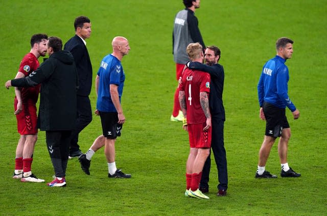 Gareth Southgate consoles Denmark’s Simon Kjaer after the semi-final