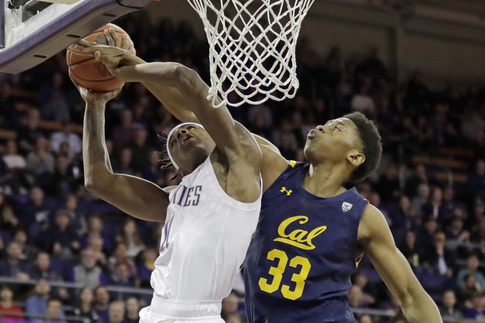 Washington guard Nahziah Carter, left, competes for a rebound against California forward D.J. Thorpe, right, during the second half of an NCAA college basketball game Saturday, Feb. 22, 2020, in Seattle. Washington won 87-52. (AP Photo/Ted S. Warren)