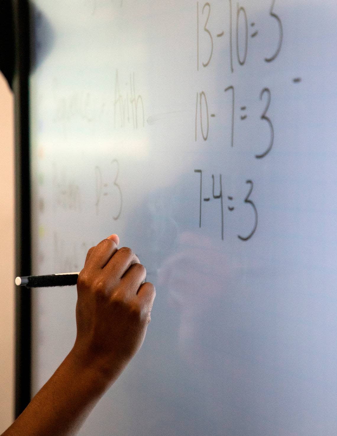 Knightdale High School teacher Alex Johnson explains examples of sequences during a math class on Tuesday, Sept. 5, 2023, in Knightdale, N.C. Kaitlin McKeown/kmckeown@newsobserver.com