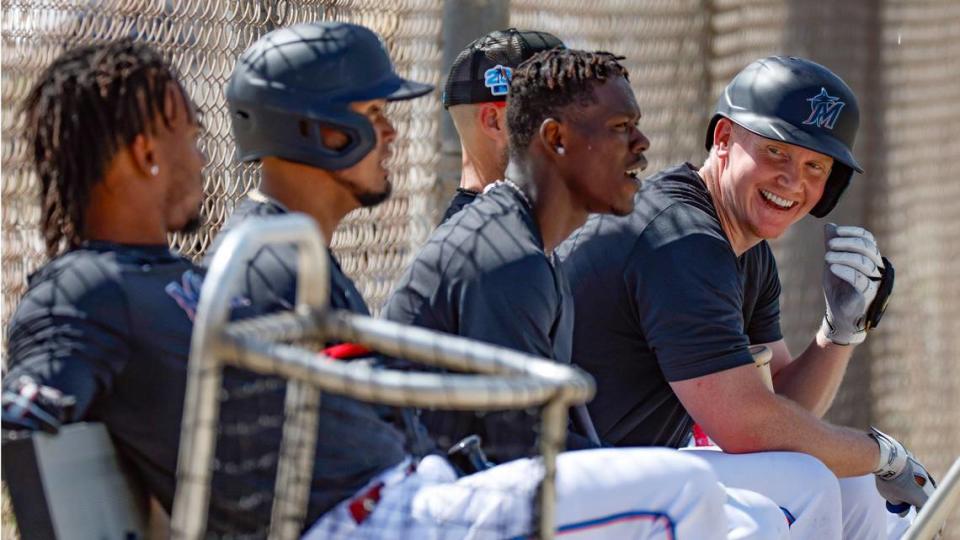 Miami Marlins players (from left) Jean Segura, Luis Arraez, Jazz Chisholm Jr. and Garrett Cooper sit on the bench at Roger Dean Chevrolet Stadium in Jupiter, Florida on Tuesday, February 21, 2023.