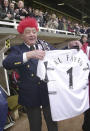 FILE - Fulham chairman Mohamed Al Fayed celebrates his team's promotion to the Premier League, before the game against Sheffield at Craven Cottage, in London, Wednesday, April 16, 2001. Al Fayed, the former Harrods owner whose son Dodi was killed in a car crash with Princess Diana, has died at age 94. His death was announced Friday, Sept. 1, 2023, by Fulham Football Club, which Al Fayed once owned. (Toby Melville/PA via AP, File)