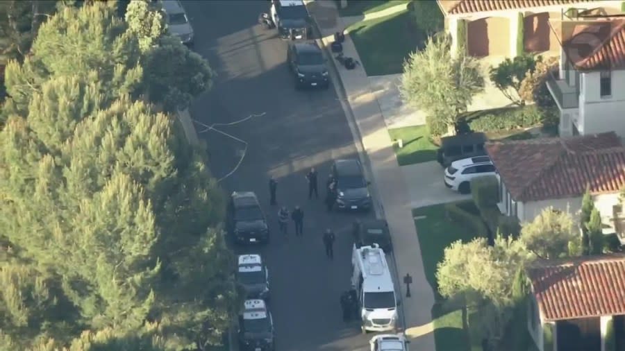 Law enforcement officials outside the scene of a possible home invasion in Newport Beach, CA on April 16, 2024. (Sky5)