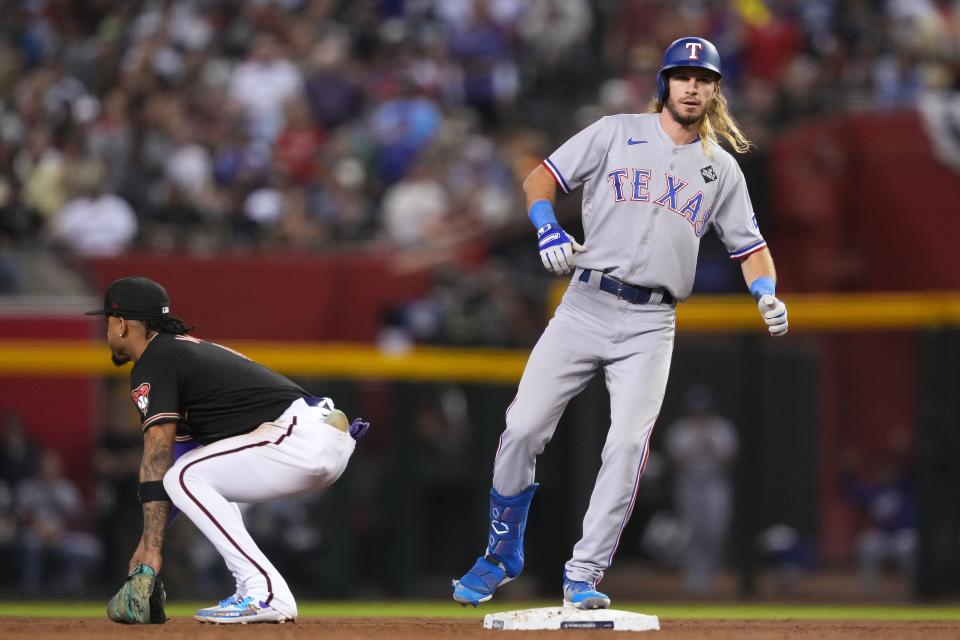 Texas Rangers left fielder Travis Jankowski (16) reacts after hitting a double against the Arizona Diamondbacks during the third inning Oct. 31.