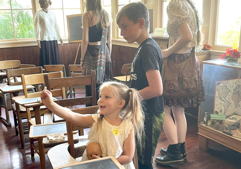 Charlotte Bastianelli and Brady Johnsrud checked out the 1909 schoolhouse at the Coachella Valley History Museum. (Linda Jacobson/The 74)