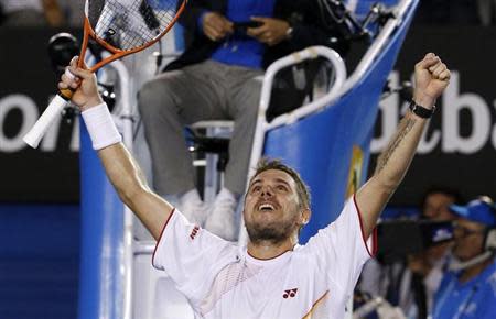 Stanislas Wawrinka of Switzerland celebrates defeating Rafael Nadal of Spain in their men's singles final match at the Australian Open 2014 tennis tournament in Melbourne January 26, 2014. REUTERS/Jason Reed