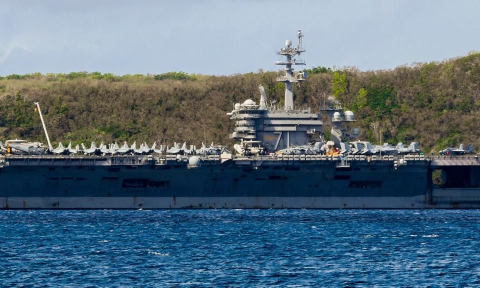 The USS Theodore Roosevelt, a Nimitz-class nuclear powered aircraft carrier, is docked in Guam as its entire crew of about 5,000 is tested for coronavirus.