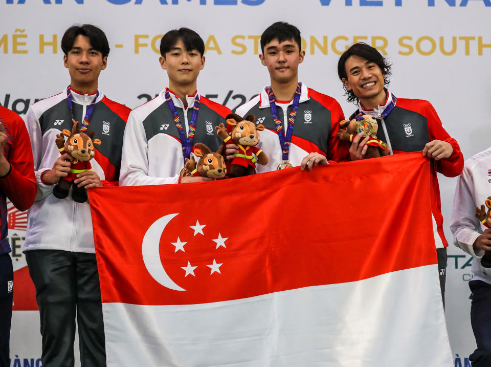 Singapore's men's epee fencing team with their gold medals at the Hanoi SEA Games. (PHOTO: SNOC/ Kelly Wong)