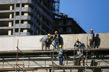 People work on a construction site in central Pyongyang, North Korea April 12, 2017. REUTERS/Damir Sagolj