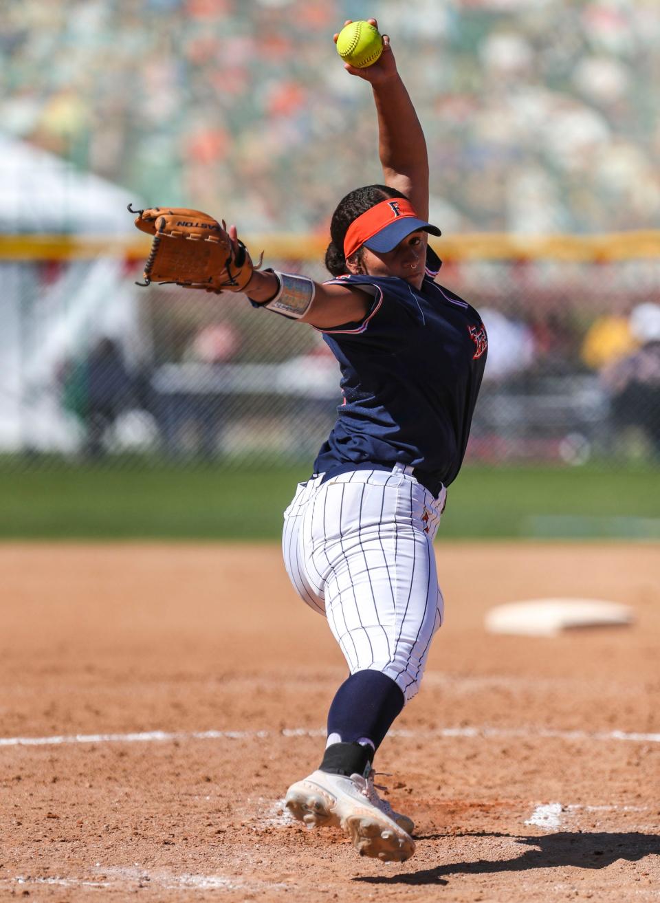 CSU Fullerton's Staci Chambers (9) winds up a pitch during their game at the Mary Nutter Collegiate Classic in Cathedral City, Calif., Friday, Feb. 25, 2022.