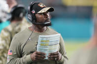 Miami Dolphins head coach Brian Flores watches the game from the sidelines during the first half of an NFL football game against the Baltimore Ravens, Thursday, Nov. 11, 2021, in Miami Gardens, Fla. (AP Photo/Wilfredo Lee)