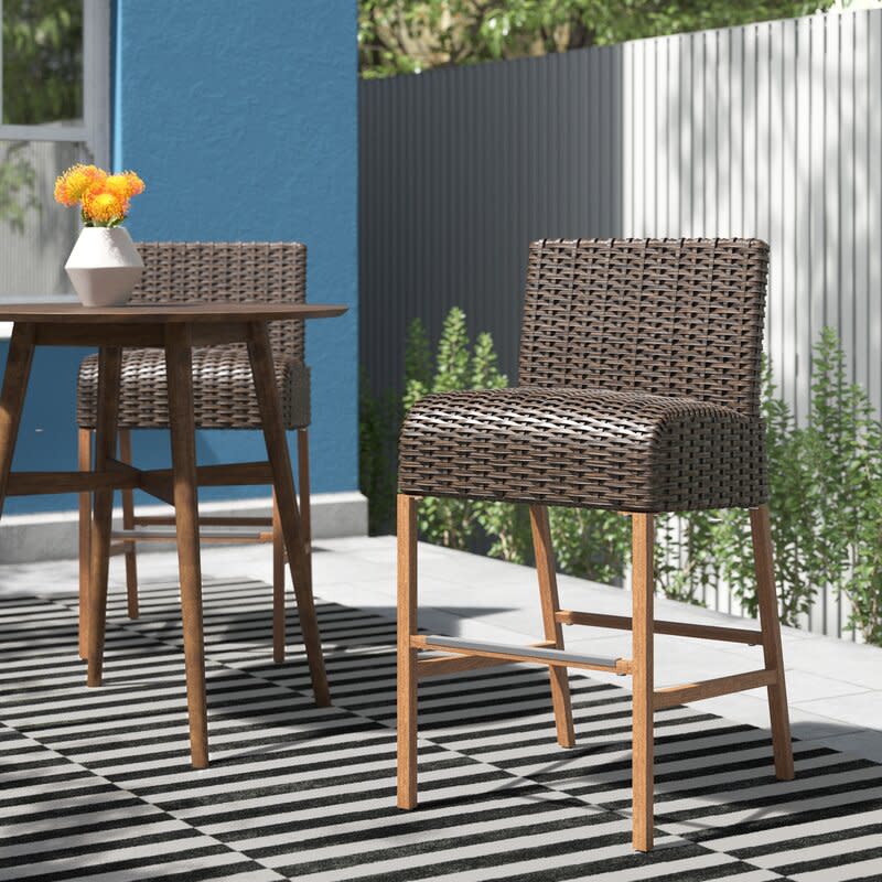 Woodstock 28.5'' Patio Bar Stool (Set of 2). Image via Wayfair.