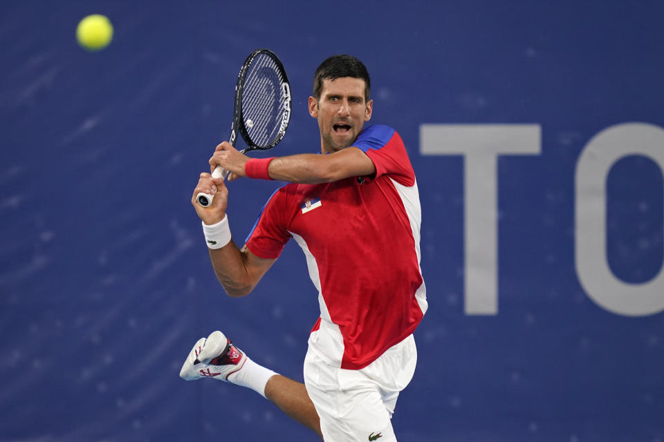 Novak Djokovic, of Serbia, plays Kei Nishikori, of Japan, during the quarterfinals of the tennis competition at the 2020 Summer Olympics, Thursday, July 29, 2021, in Tokyo, Japan. (AP Photo/Seth Wenig)