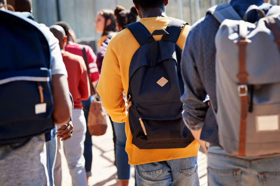  Rear view of students walking at a school campus. (STOCK PHOTO/Getty Images)