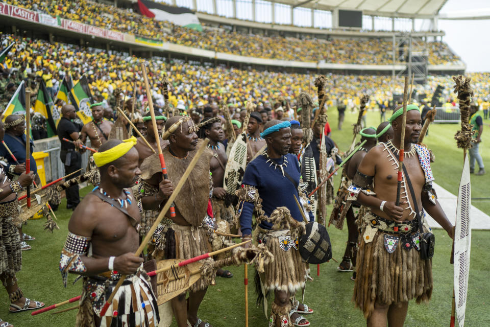 Zulu warriors and African National Congress supporters gather at the Mose Mabhida stadium in Durban, South Africa, Saturday, Feb. 24, 2024, for their national manifesto launch in anticipation of the 2024 general elections. (AP Photo/Jerome Delay)