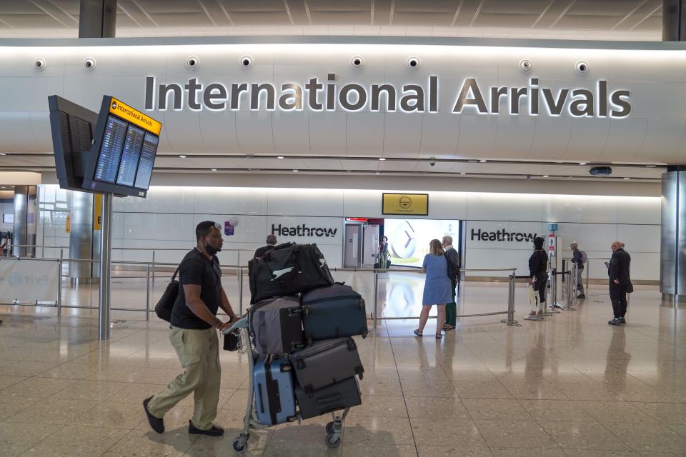 Passengers in the international arrivals hall at Terminal 2 of London Heathrow Airport (Steve Parsons/PA) (PA Wire)