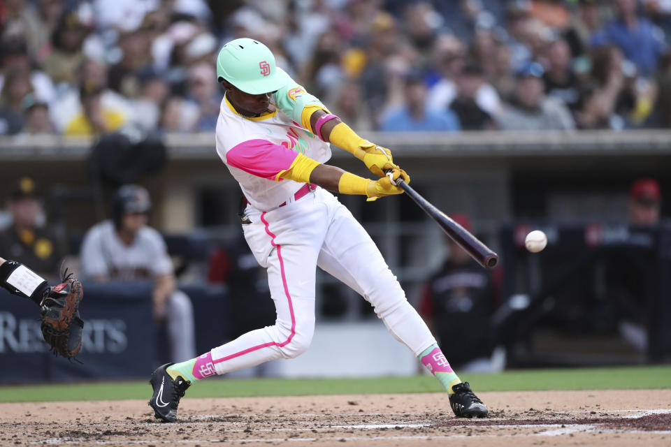 San Diego Padres' Esteury Ruiz hits an RBI single against the Arizona Diamondbacks during the second inning of a baseball game Friday, July 15, 2022, in San Diego. (AP Photo/Derrick Tuskan)