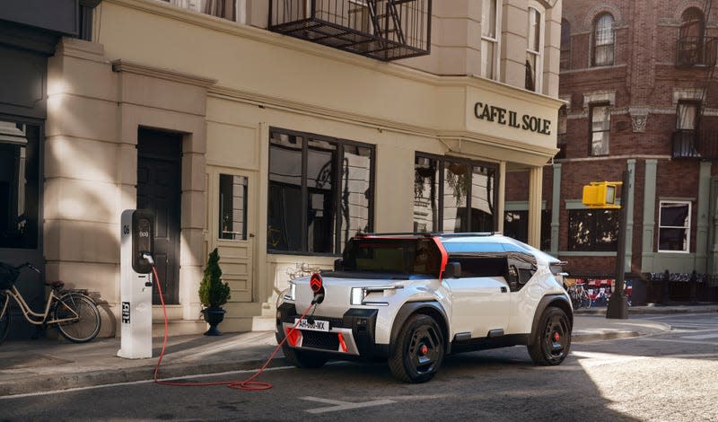 Citroën Oli concept promotional image, parked and charging.