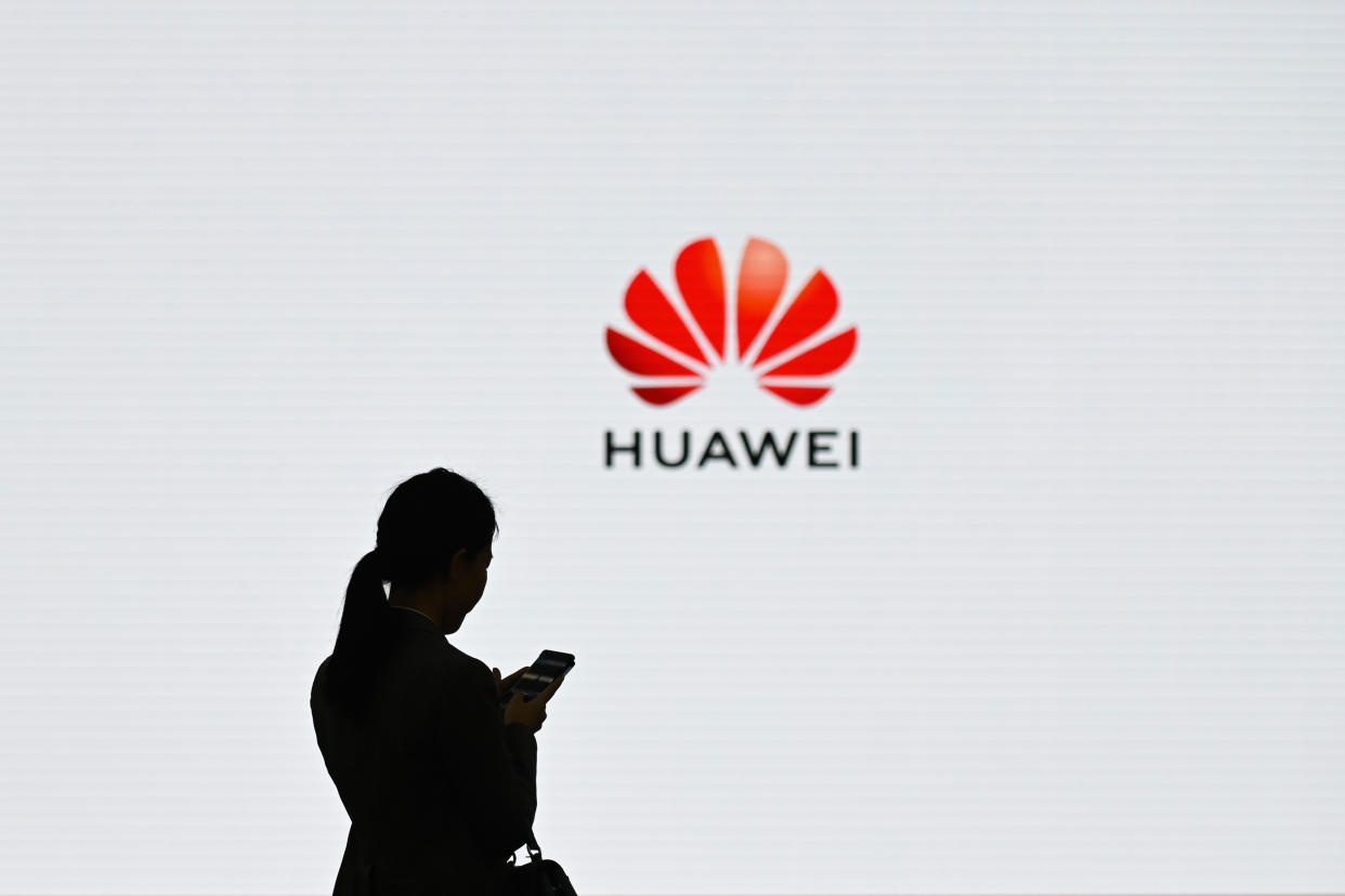 A staff member of Huawei uses her mobile phone at the Huawei Digital Transformation Showcase in Shenzhen, China's Guangdong province on March 6, 2019.  Photo: WANG ZHAO/AFP/Getty Images