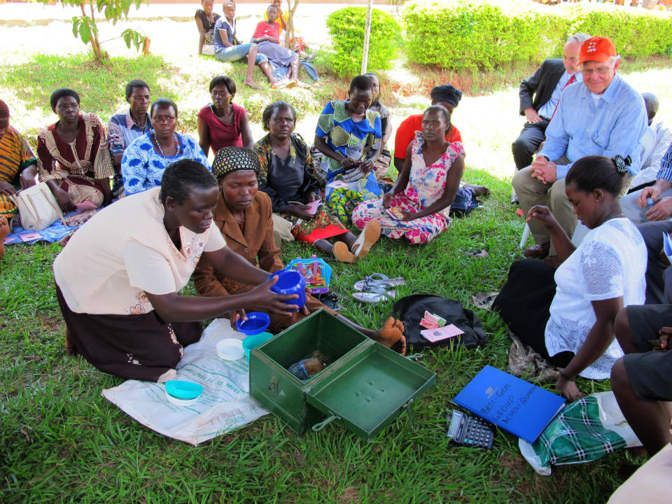 In this 2012 file photo, women with AIDS share stories of survival at a clinic in Uganda. The clinic receives money from the U.S. President's Emergency Plan for AIDS Relief, or PEPFAR.