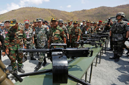 Major General Zhang Jian, commander of the Chinese People's Liberation Army Southern Theatre Command and Pol Saroeun, commander-in-chief of the Cambodian military attend the opening of the "Dragon Gold 2018" military exercise in Kampong Speu province, Cambodia, March 17, 2018. REUTERS/Stringer