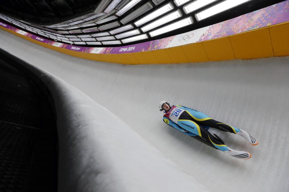 Yelizaveta Axenova of Kazakhstan speeds down the track during the women's singles luge competition at the 2014 Winter Olympics, Monday, Feb. 10, 2014, in Krasnaya Polyana, Russia. (AP Photo/Natacha Pisarenko)