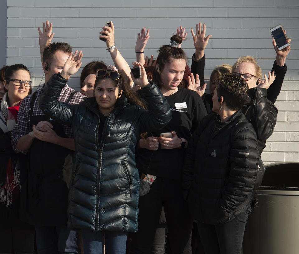 Shoppers are evacuated from Fashion Place Mall in Murray, Utah, after a shooting on Sunday, Jan. 13, 2019. (Rick Egan/The Salt Lake Tribune via AP)