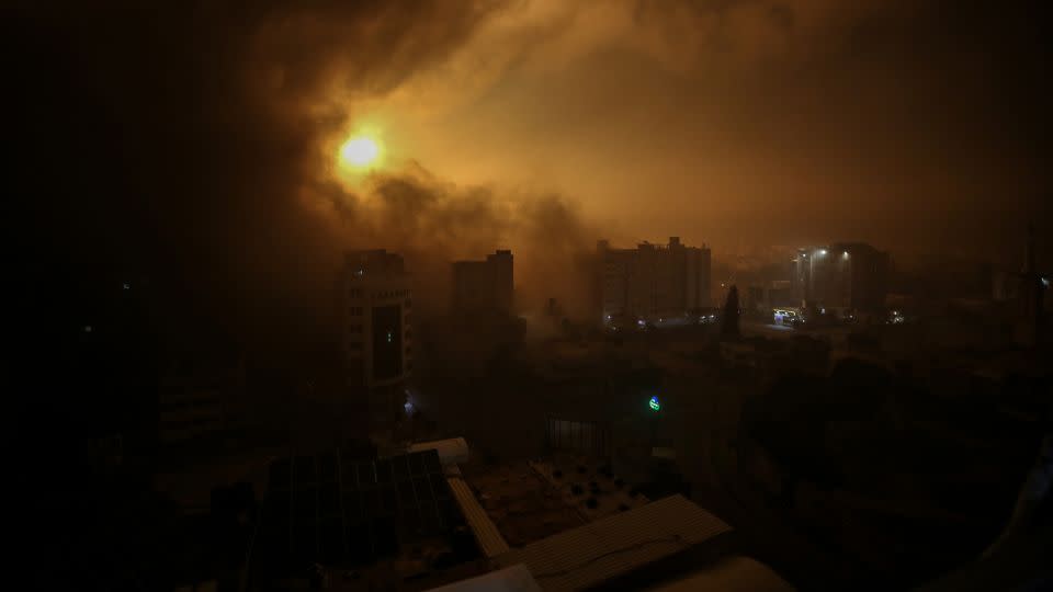 Flames rise in Burc Vatan shopping mall in Gaza following bombing of Israeli forces with warplanes.  - Ali Jadallah/Anadolu Agency/Getty Images