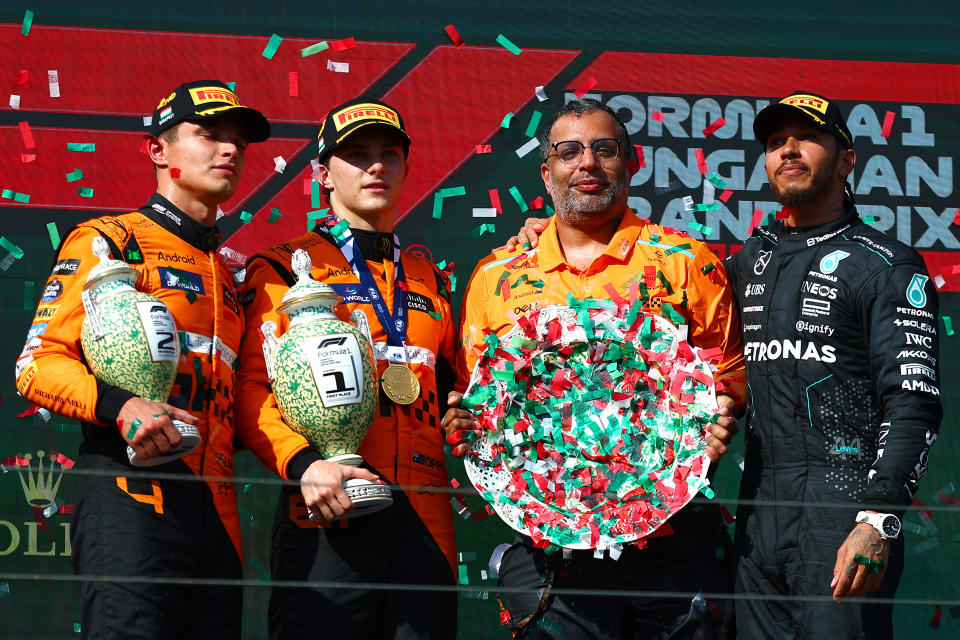 BUDAPEST, HUNGARY - JULY 21: Race winner Oscar Piastri of Australia and McLaren, Second placed Lando Norris of Great Britain and McLaren, Third placed Lewis Hamilton of Great Britain and Mercedes and Randy Singh, Strategy and Sporting Director of McLaren celebrate on the podium during the F1 Grand Prix of Hungary at Hungaroring on July 21, 2024 in Budapest, Hungary. (Photo by Joe Portlock - Formula 1/Formula 1 via Getty Images)