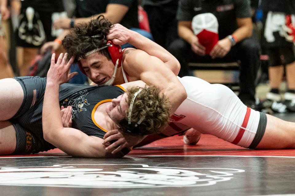 Oak Hills' Shea Gabriel turns Hesperia’s Zack Leon during their 182-pound match at the Mojave River League Finals on Friday, Feb. 3, 2023.