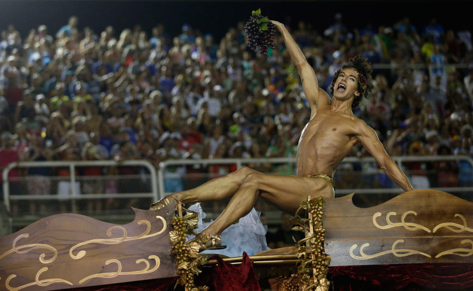 <p>A member of the Unidos da Tijuca samba school performs on a float during Carnival celebrations at the Sambadrome in Rio de Janeiro, Brazil, Monday, Feb. 12, 2018. (Photo: Silvia Izquierdo/AP) </p>