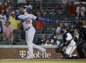 Los Angeles Dodgers' Trayce Thompson hits a two RBI single during the ninth inning of a baseball game against the Atlanta Braves, won by the Los Angeles Dodgers 5-3 on Sunday, June 26, 2022, in Atlanta. (AP Photo/Bob Andres)