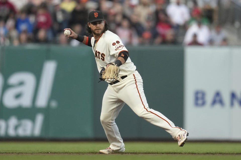 San Francisco Giants shortstop Brandon Crawford throws out Tampa Bay Rays' Osleivis Basabe at first base during the third inning of a baseball game in San Francisco, Monday, Aug. 14, 2023. (AP Photo/Jeff Chiu)