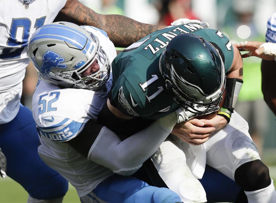 Philadelphia Eagles quarterback Carson Wentz is sacked by Detroit Lions linebacker Christian Jones in the fourth quarter at Lincoln Financial Field on Sept. 22, 2019.