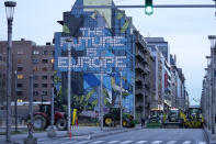 Farmers with their tractors begin to arrive, near the European Quarter in Brussels, during a demonstration outside of a meeting of EU agriculture ministers at the European Council building in Brussels, Tuesday, March 26, 2024. Tuesday marks the third time this year that farmers will take to the streets of Brussels with their tractors. (AP Photo/Virginia Mayo)