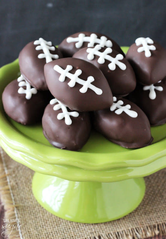 <p>Life Love and Sugar</p><p><strong>Get the recipe: </strong><a href="https://www.lifeloveandsugar.com/2015/01/07/chocolate-chip-cookie-dough-footballs/" rel="nofollow noopener" target="_blank" data-ylk="slk:Chocolate Chip Cookie Dough Footballs;elm:context_link;itc:0;sec:content-canvas" class="link rapid-noclick-resp"><strong>Chocolate Chip Cookie Dough Footballs</strong></a></p>