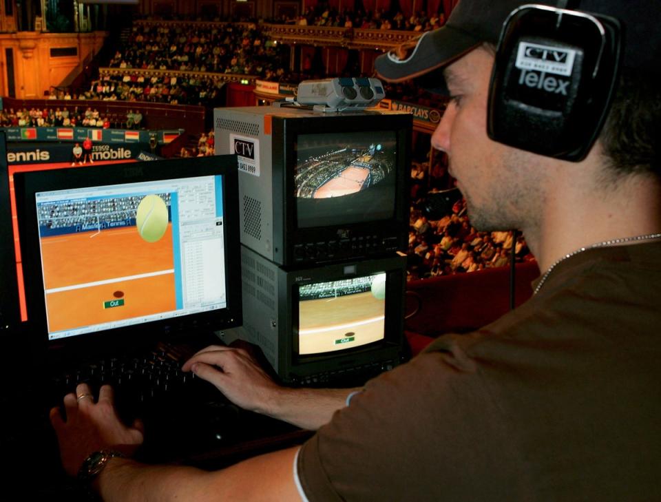 A technician watches screens with the Hawk-Eye system (Getty Images)