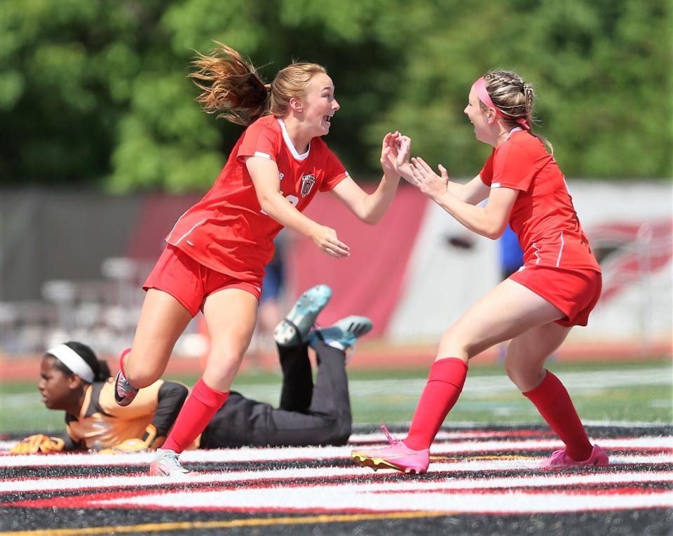 Chatham Glenwood's Rowann Law, left, celebrates with teammate Lyla Franke after scoring the opening goal against Chicago De La Salle during the Class 2A girls soccer state semifinal at Benedetti-Wehrli Stadium in Naperville on Friday, May 2, 2023.