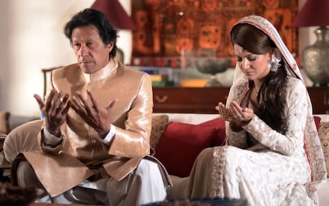 Imran Khan and his wife Reham Khan pose for a photograph during their wedding ceremony - Credit: Pakistan Thereek Insaf (PTI) Party/AFP