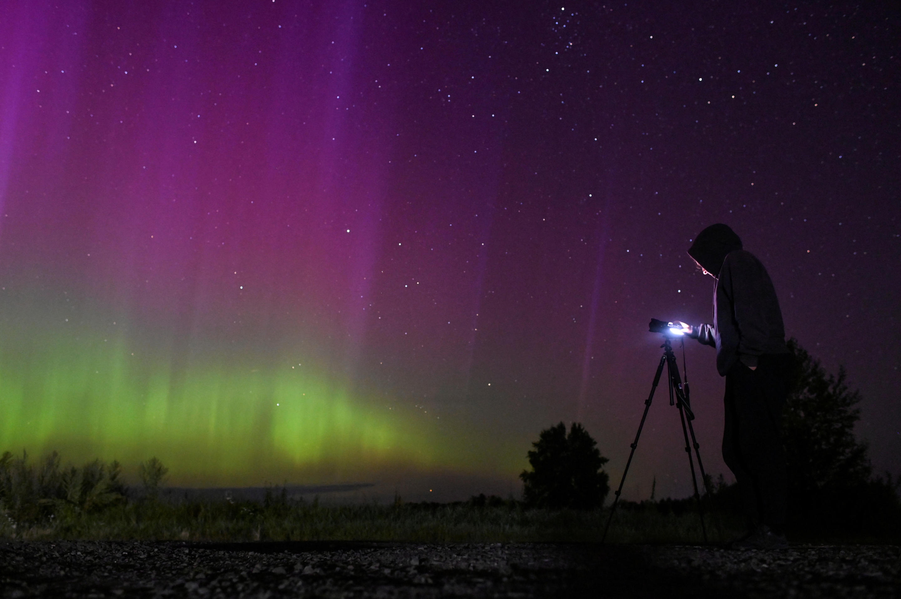 The northern lights illuminate the night sky.