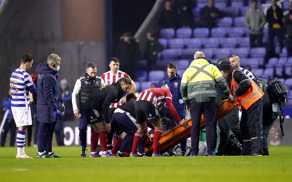 Sheffield United's John Fleck is placed on a stretcher during the Sky Bet Championship match at the Madejski Stadium, Reading. - PA