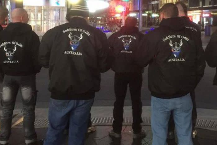 The group have been seen roaming Melbourne's CBD in black jackets with the group's logo.