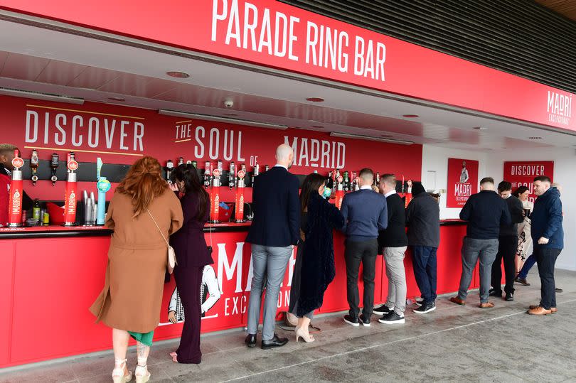 Racegoers at the Parade Ring Bar at the Grand National Festival in Aintree Racecourse