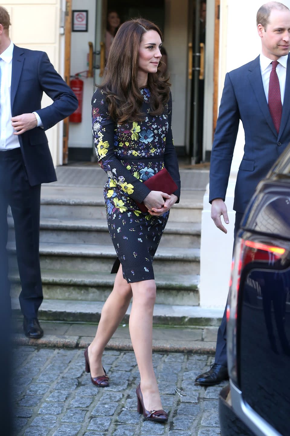 <p>Middleton wears a navy floral dress by Erdem, oxblood pumps and a deep red suede clutch in London, where she, Prince William and Prince harry spoke about their work with the Heads Together organization.</p>