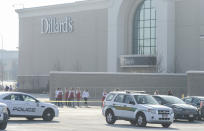 Police escort employees from Dillard's out of the Fashion Place Mall in Murray, Utah, after a shooting on Sunday, Jan. 13, 2019.(Francisco Kjolseth/The Salt Lake Tribune via AP)