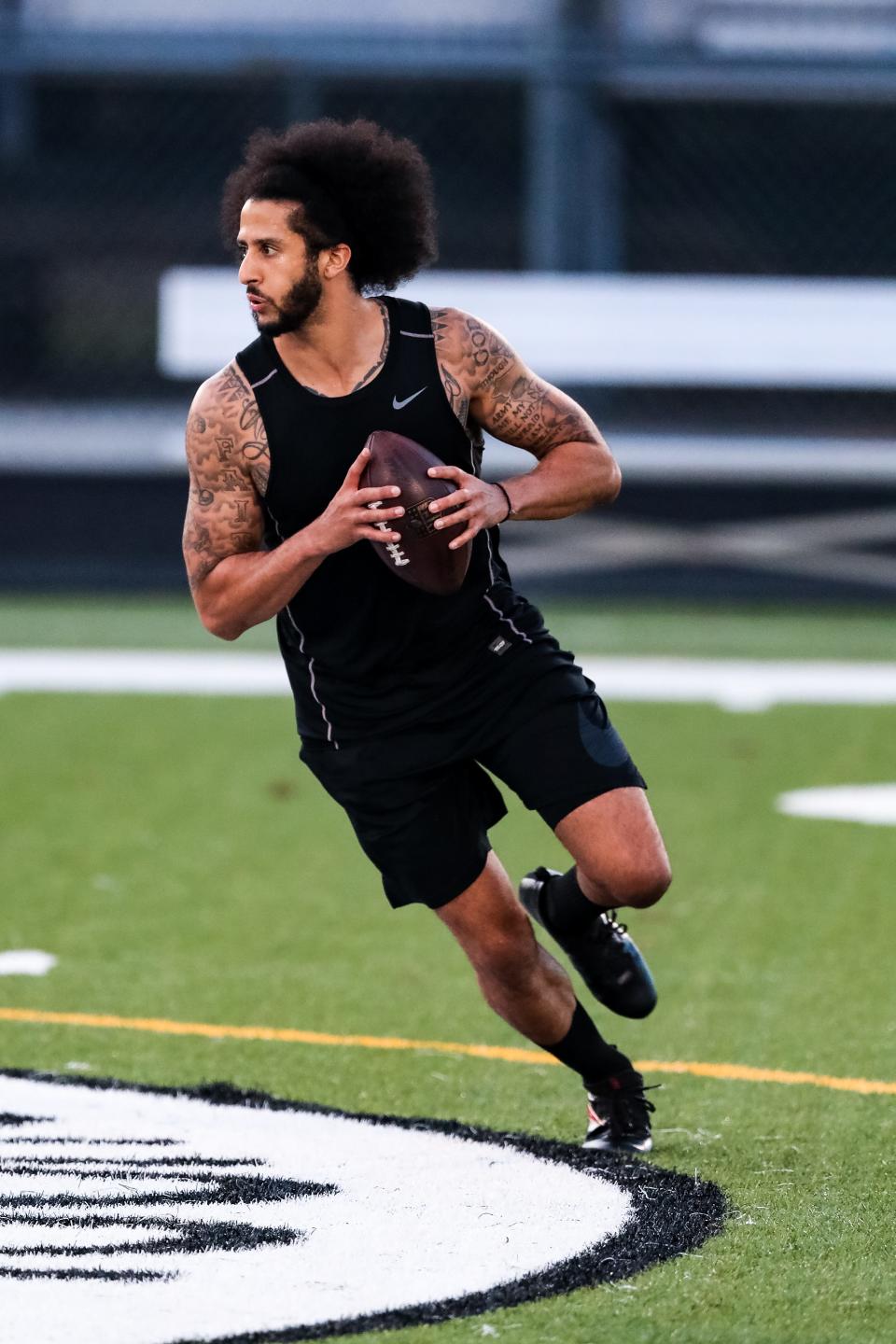 Colin Kaepernick looks to pass during his NFL workout held at Charles R Drew high school on November 16, 2019 in Riverdale, Georgia.