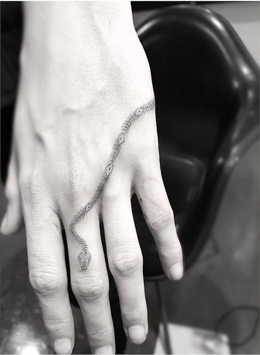 Cara Delevigne’s Meaningful Snake Tattoo