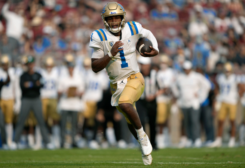 UCLA quarterback Dorian Thompson-Robinson runs for a two-yard, second-quarter touchdown against Stanford on Sept. 25, 2021.
